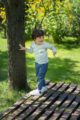 Spielender Junge mit blauer Denim Babyhose mit Tasche Jeans Optik & Auto Patch - Kinder Langarmshirt blau-weiß gestreift mit Brusttasche von Pinokio - Babyphoto Kinderphoto